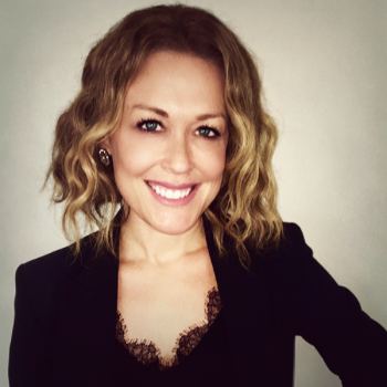 Smiling professional woman in blazer portrait